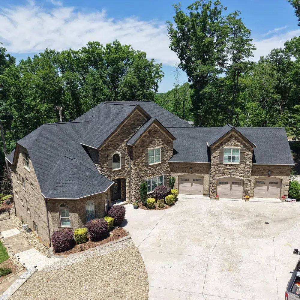 Lake Norman roof replacement project showing a dark roof on a brick home.